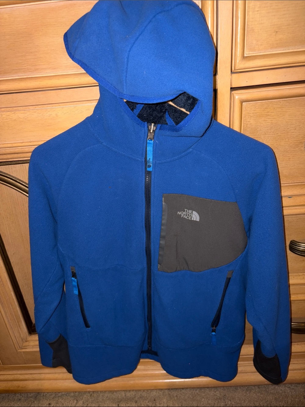 The North Face Kids Royal Blue Hooded Fleece Jacket with Black Chest Pocket